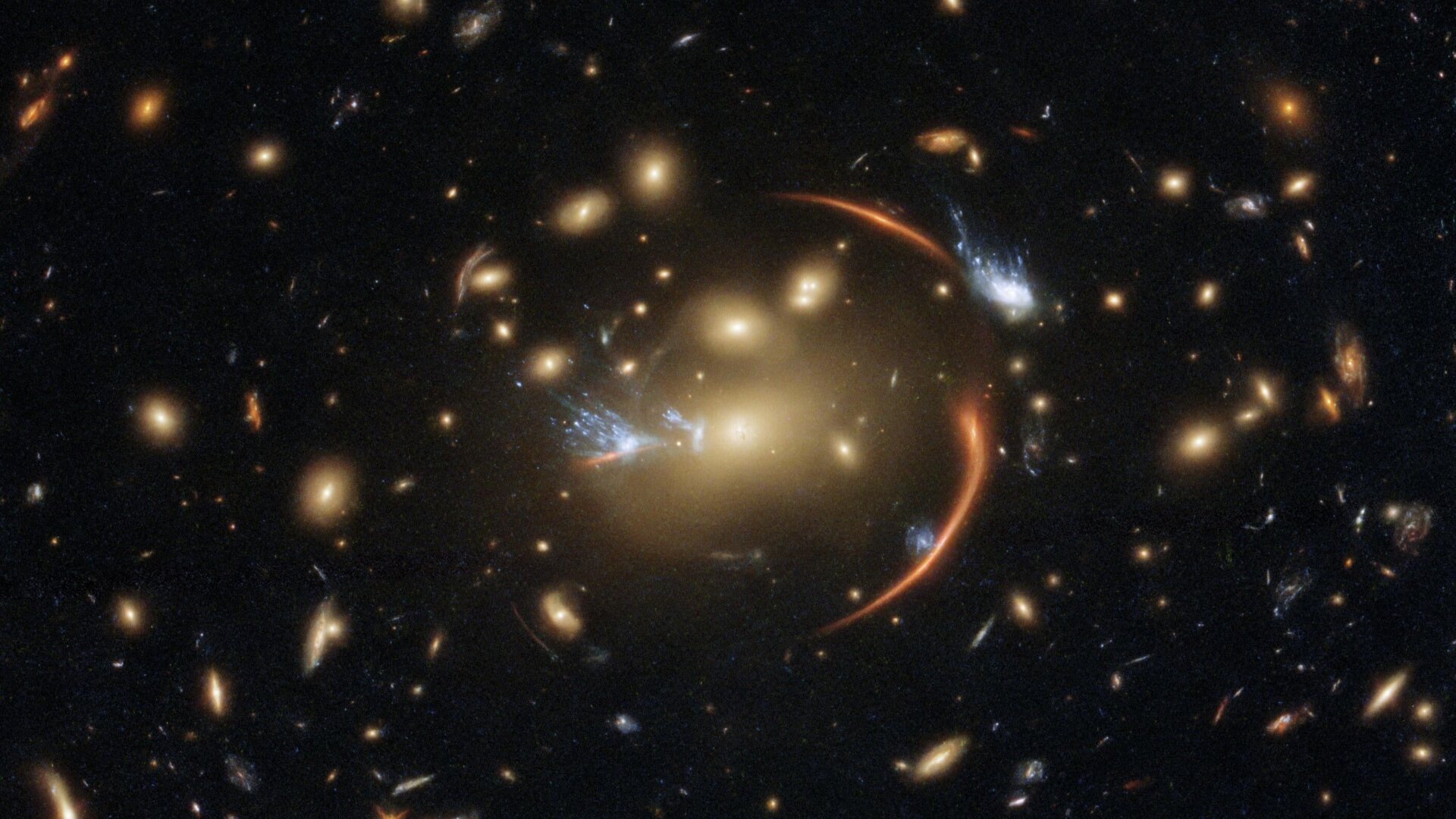 Las lentes gravitatorias distorsionan la luz de fuentes distantes, de lo que se deduce la existencia de materia oscura