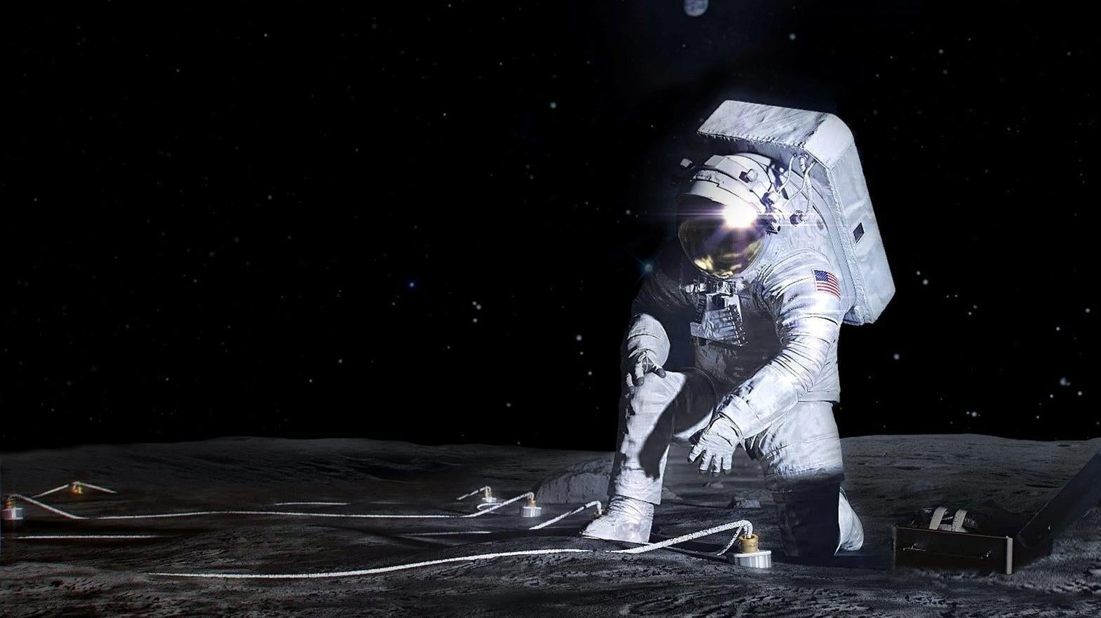 La concepción artística de un astronauta Artemisa desplegando un instrumento en la superficie de la Luna.