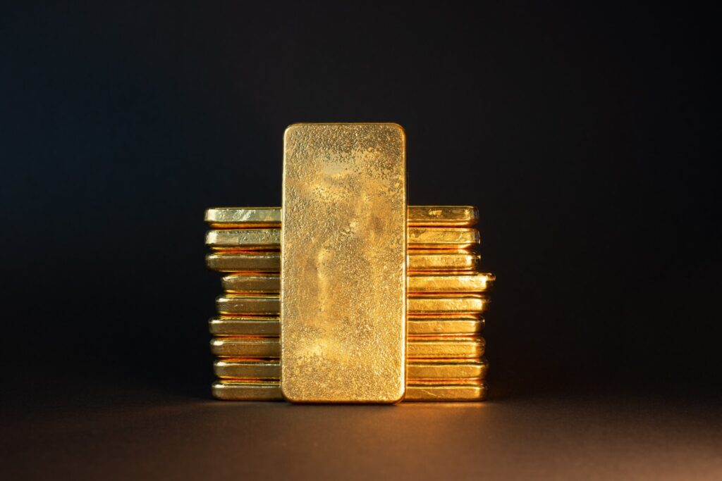 Gold,bullion,bar,on,dark,background.,large,cast,investment,gold