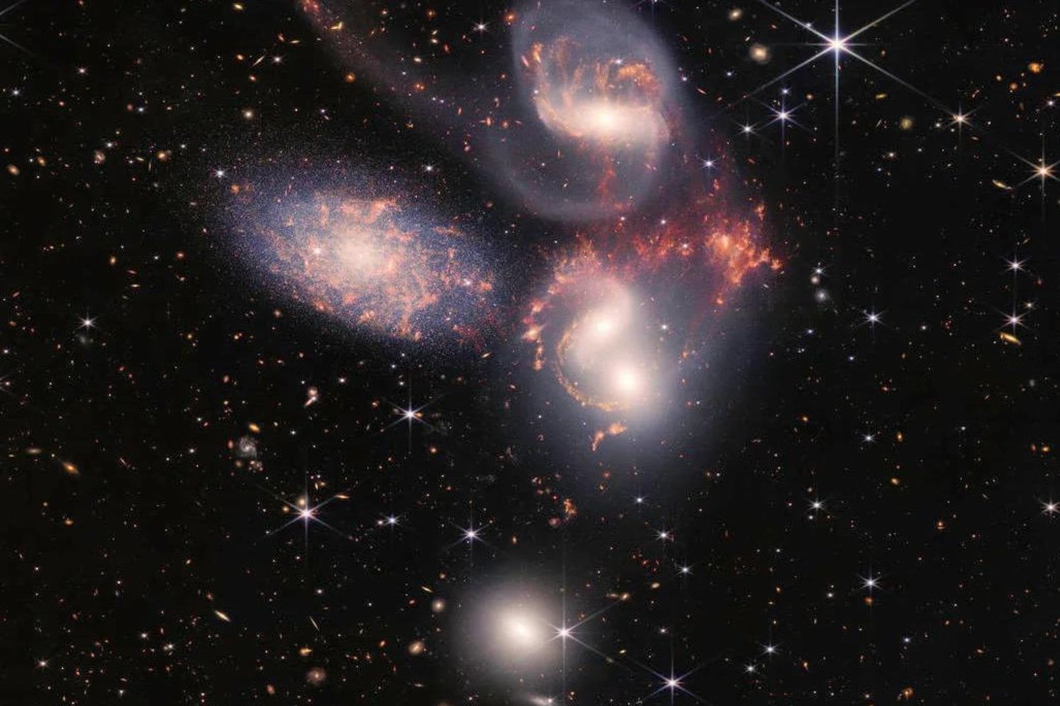 El James Webb encontró tres agujeros negros gigantes en una galaxia de hace 12.500 millones de años. Uno de ellos está haciendo algo que los científicos no esperaban